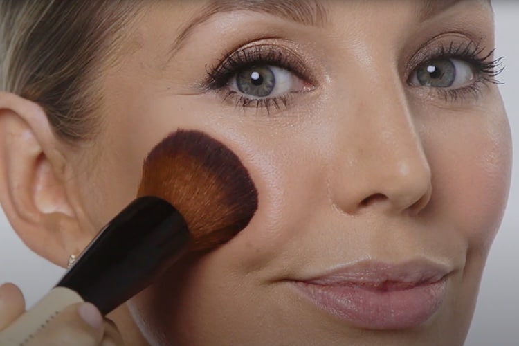 Video still of Global Pro Artist Amy Conway, applying blush to cheeks